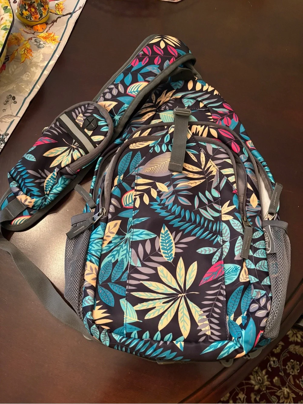 lug Navy Sling Backpack with Teal, Yellow, Pink & Cream Leaf Print